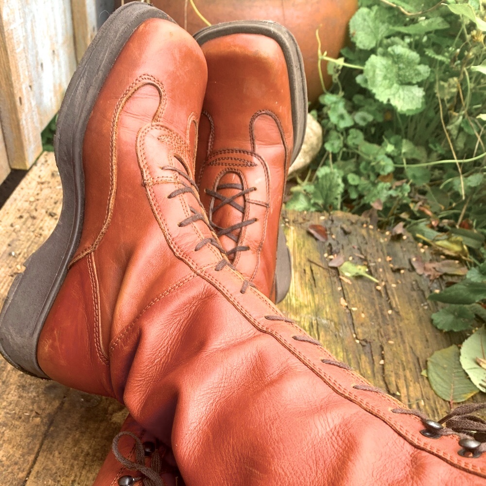 Tall lace-up leather boots